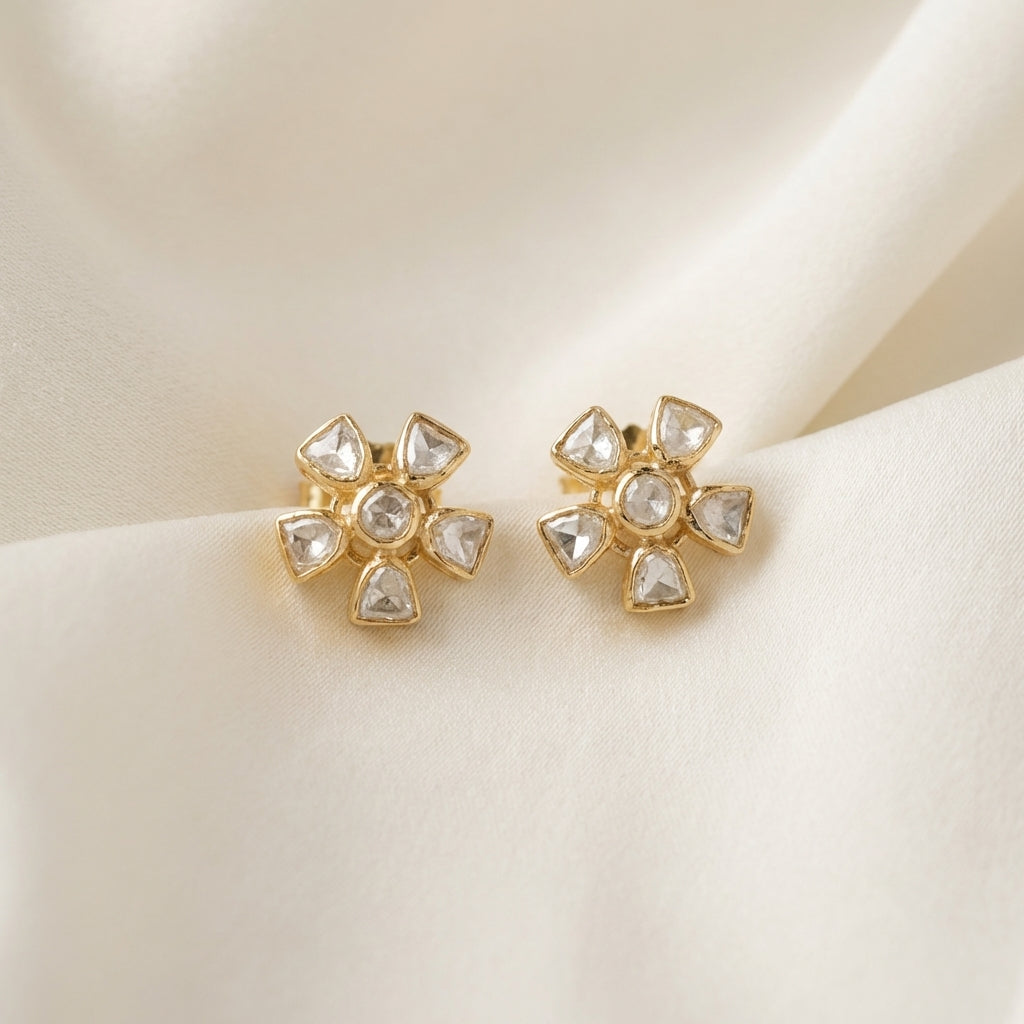 ZEVARAZ Aabha Champa Studs photographed on cream silk