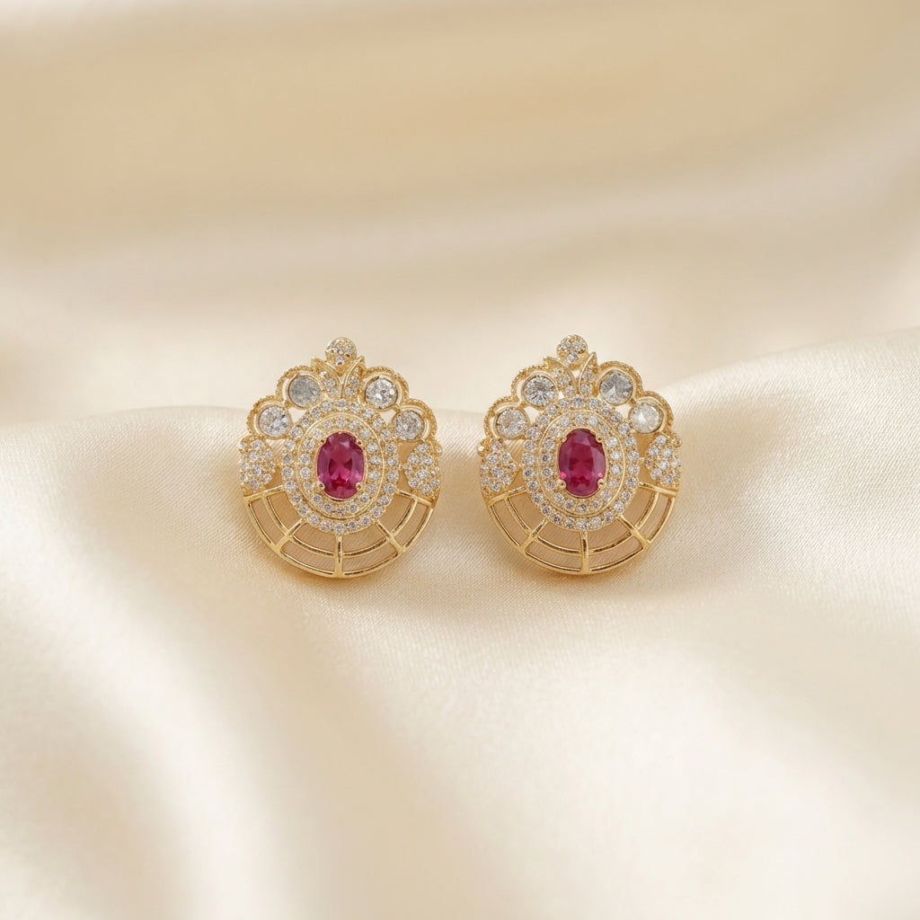 ZEVARAZ Aabha Kesar Studs photographed on cream silk