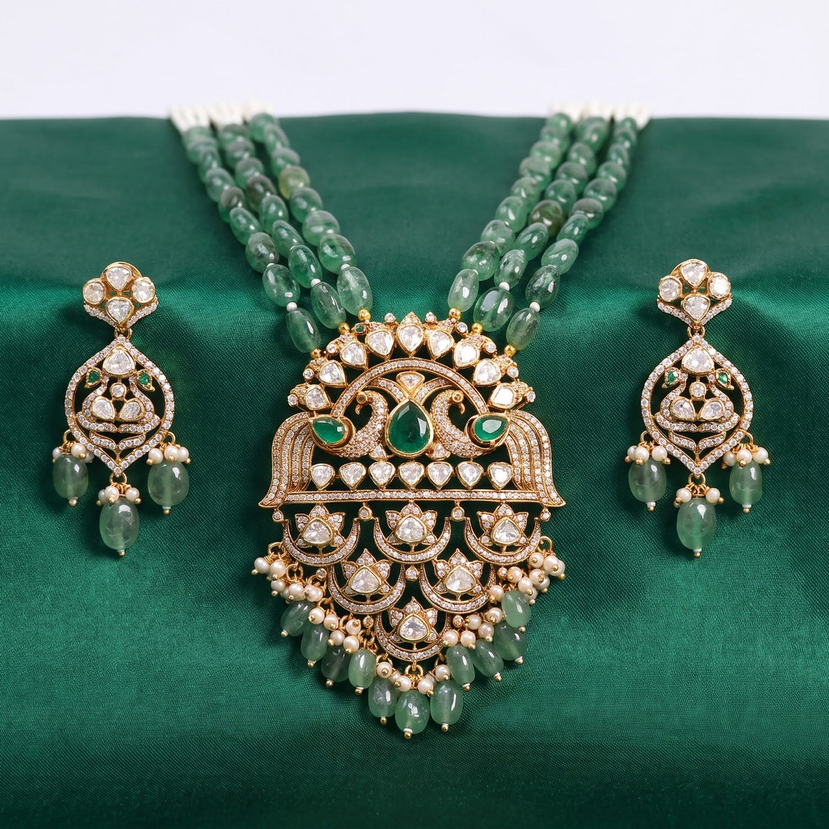 ZEVARAZ Aabha Padak Necklace Set arranged on green silk, full set view